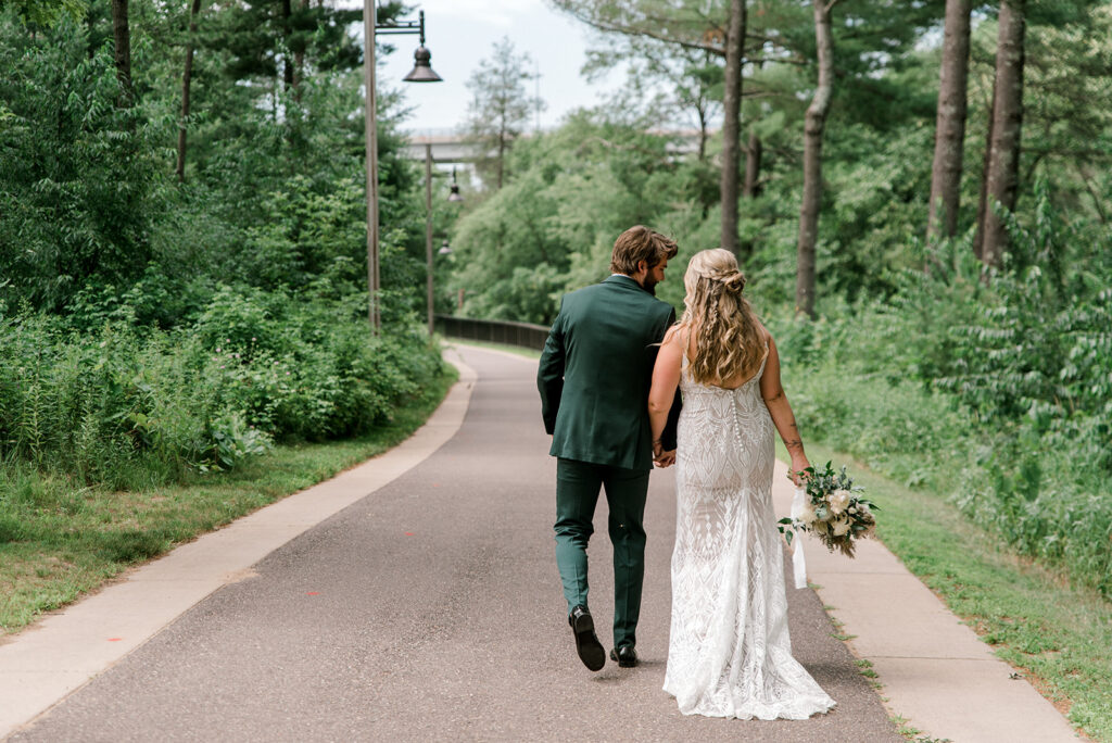 Couple enjoying a walk after just being married at River Prairie Center