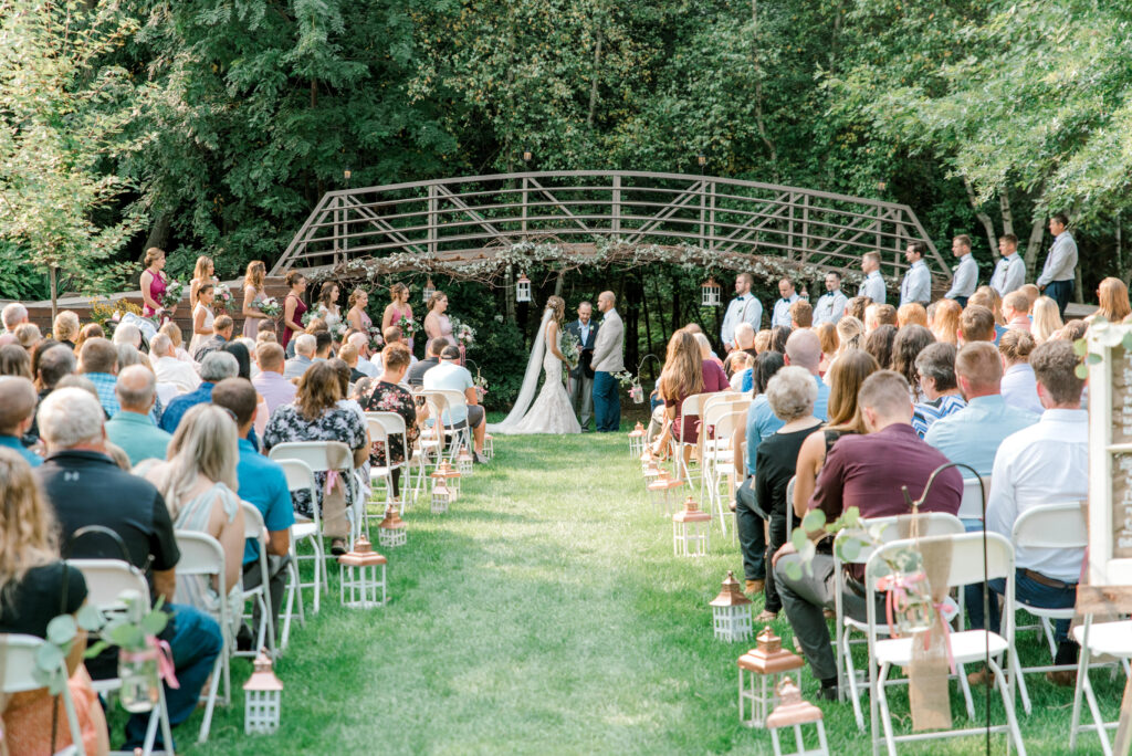 Couple getting married in wooded wedding venue in Eau Claire, WI