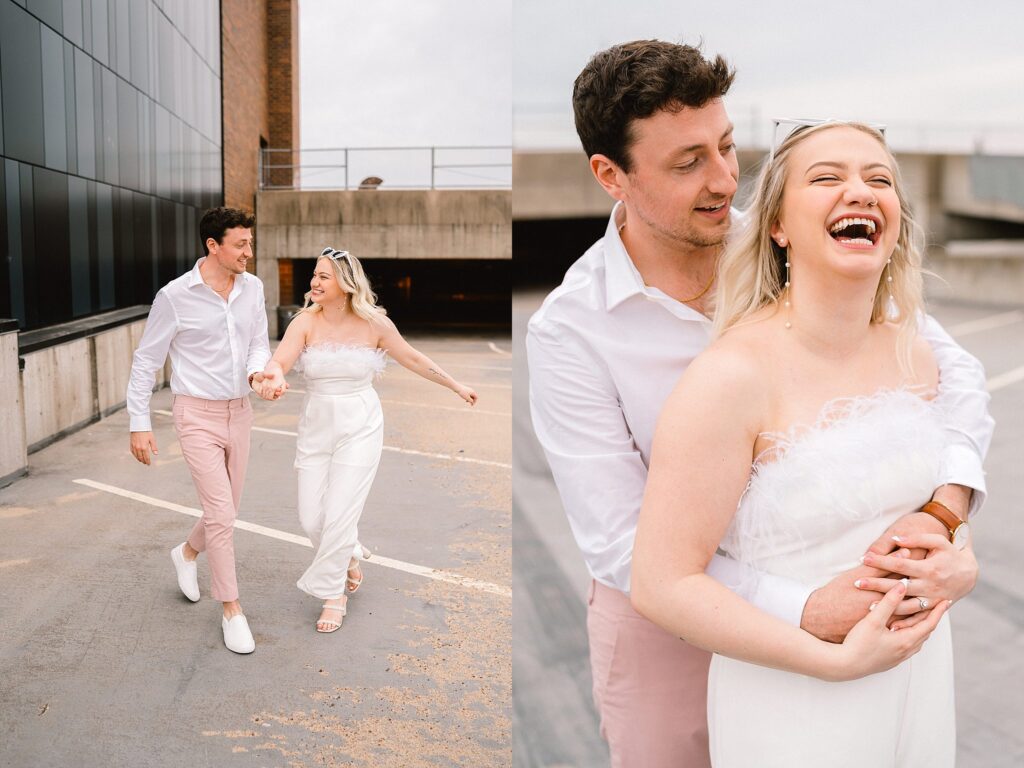 A woman and man hold hands and walk on a parking ramp rooftop during a downtown Eau Claire engagement session