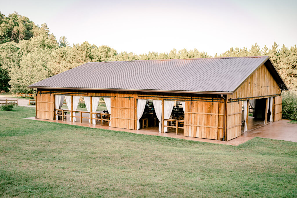 The wooded pavilion with open sides at the Burlap and Bells wedding venue